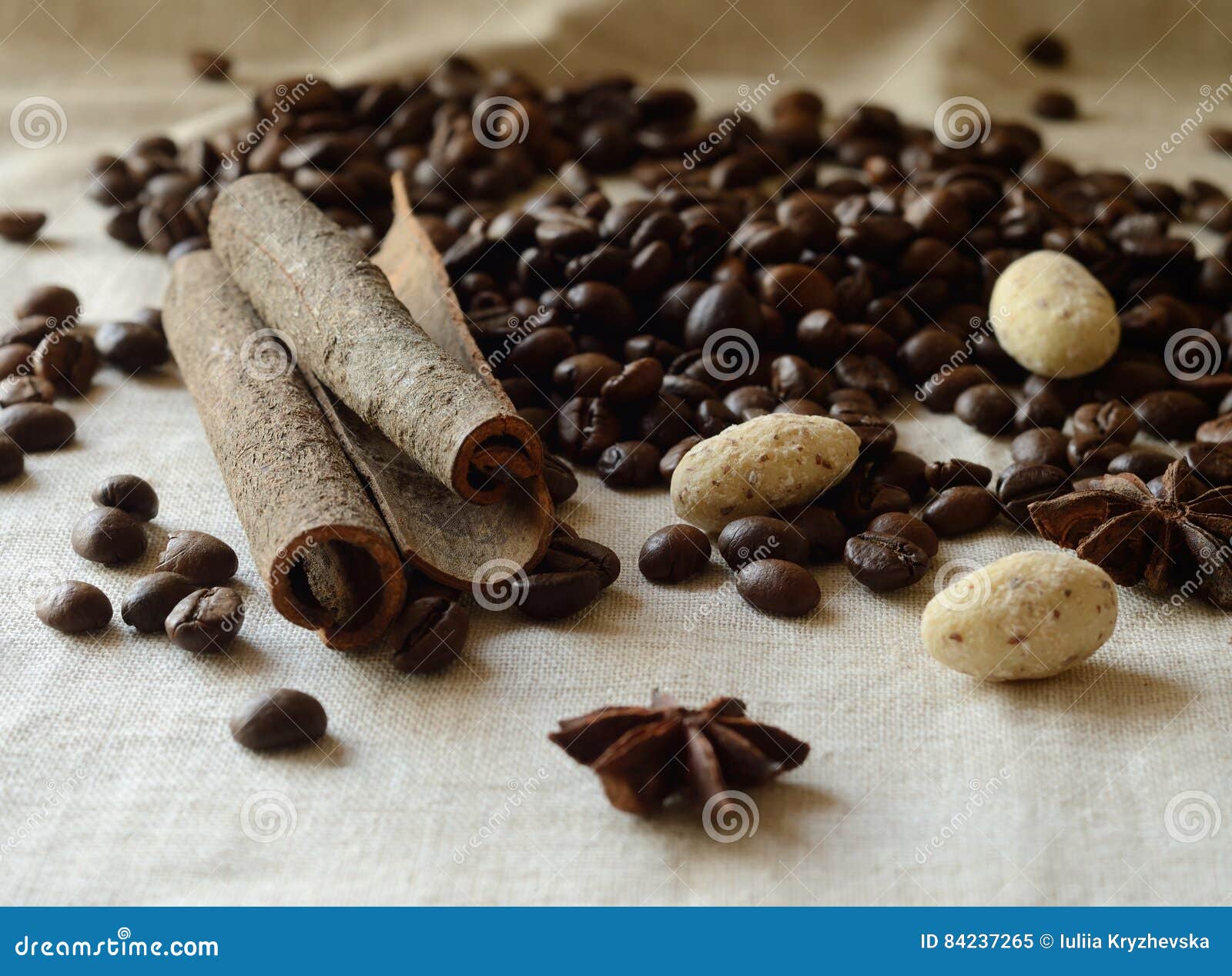 cinnamon sticks,coffee beans,anise and almond candies still life