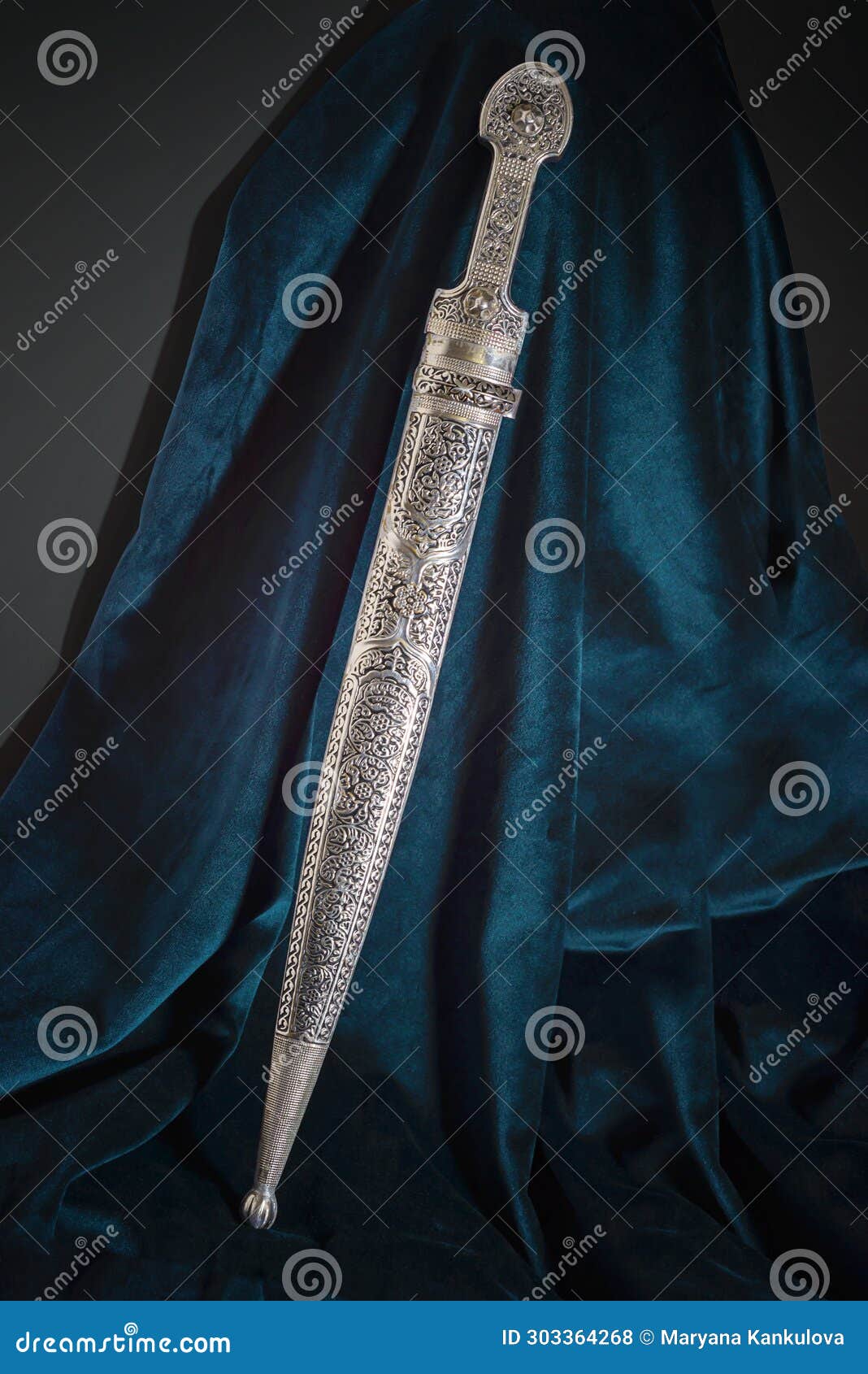 circassian adyghe kama silver dagger on velvet dark material.