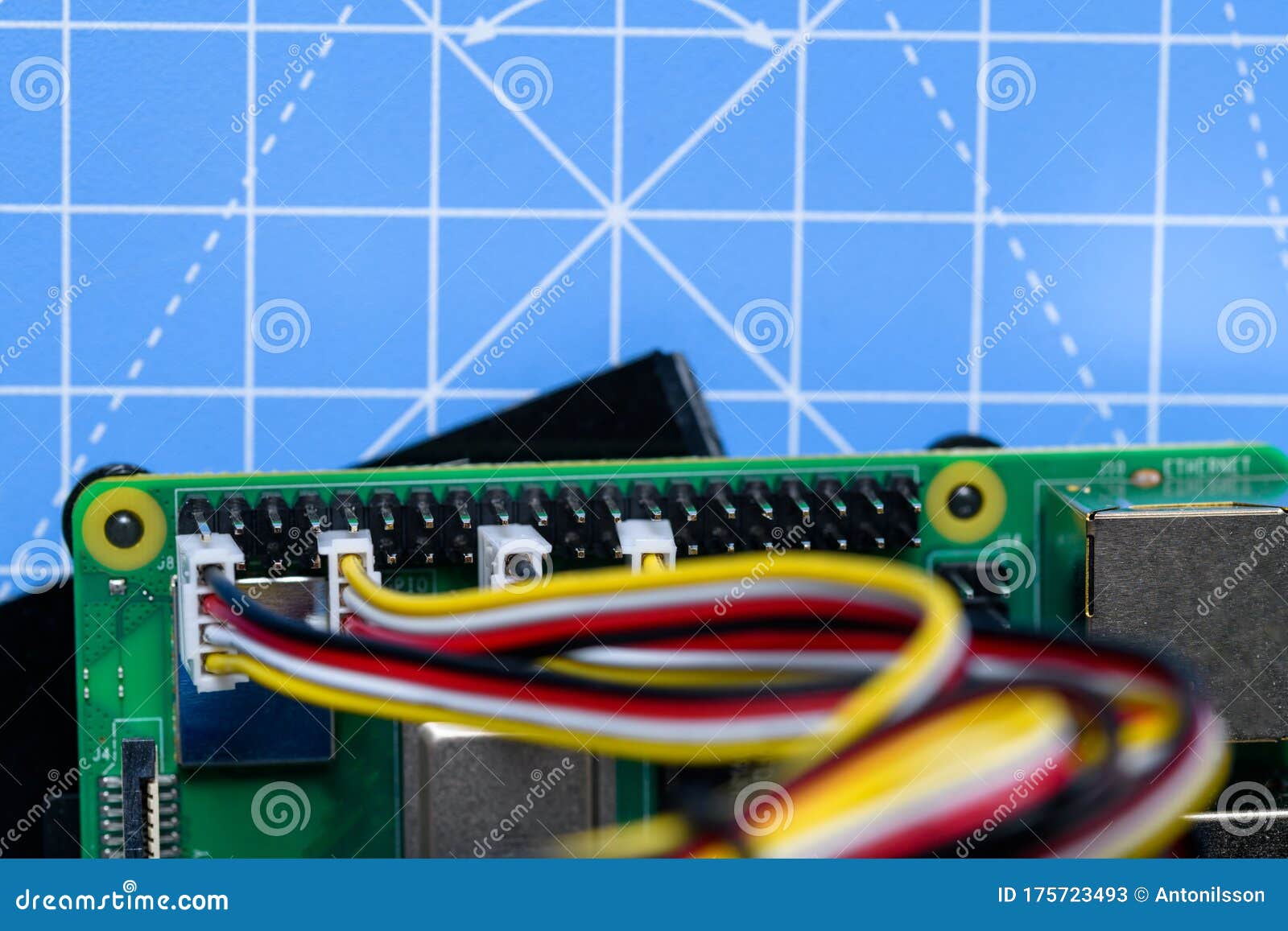 Circuit Board with Cables Connected on a Blue Background. Stock Image