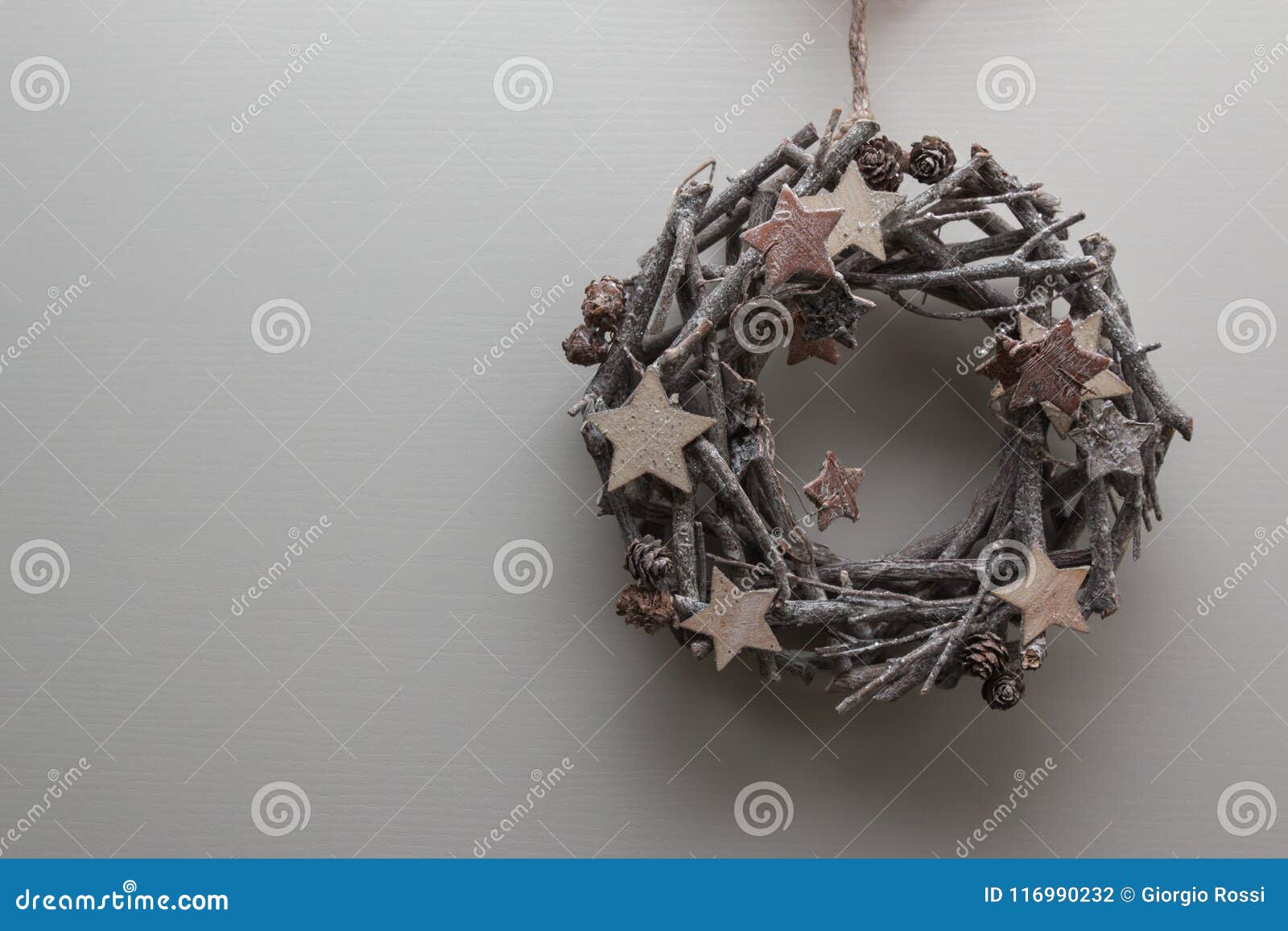 Circular Branches Woven: Christmas Decoration With Wooden Star And A Circular Decoration Of Branches For Christmas