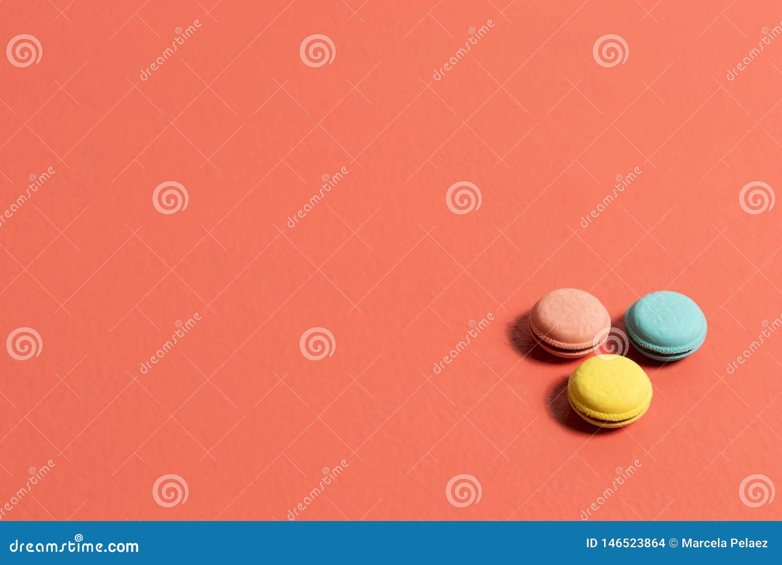 circular erasers in pink blue and yellow colors on a coral table