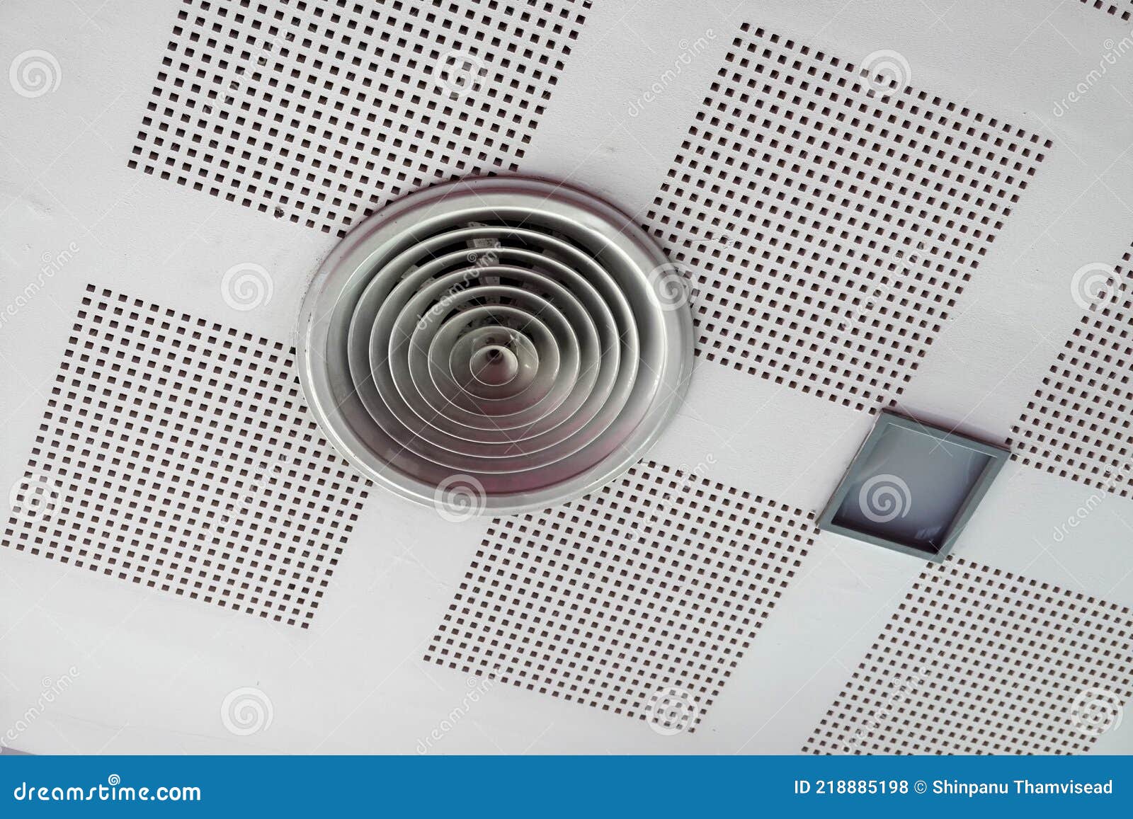 Circular Exhaust Air Grille on Ceiling at Store or Office. Stock Photo