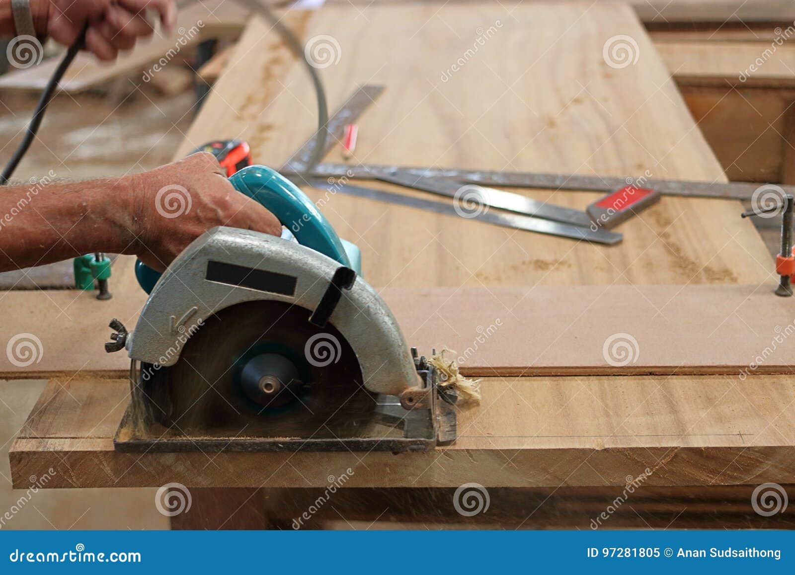 Circular Saw Cutting Piece of Wood in Carpentry Stock Image