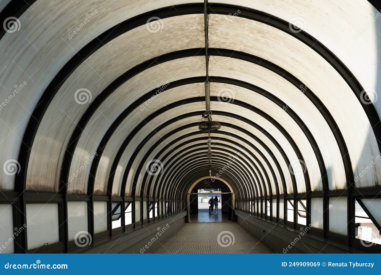 Circular Tunnel with Pedestrians Walking Out. Inside of Corridor for