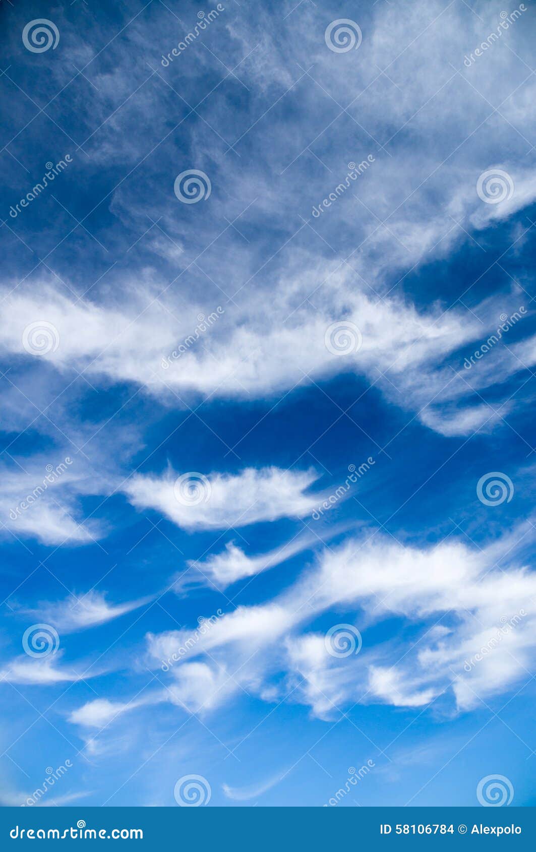 Cirrus and Stratus Clouds Against Bright Blue Sky Stock Photo Image