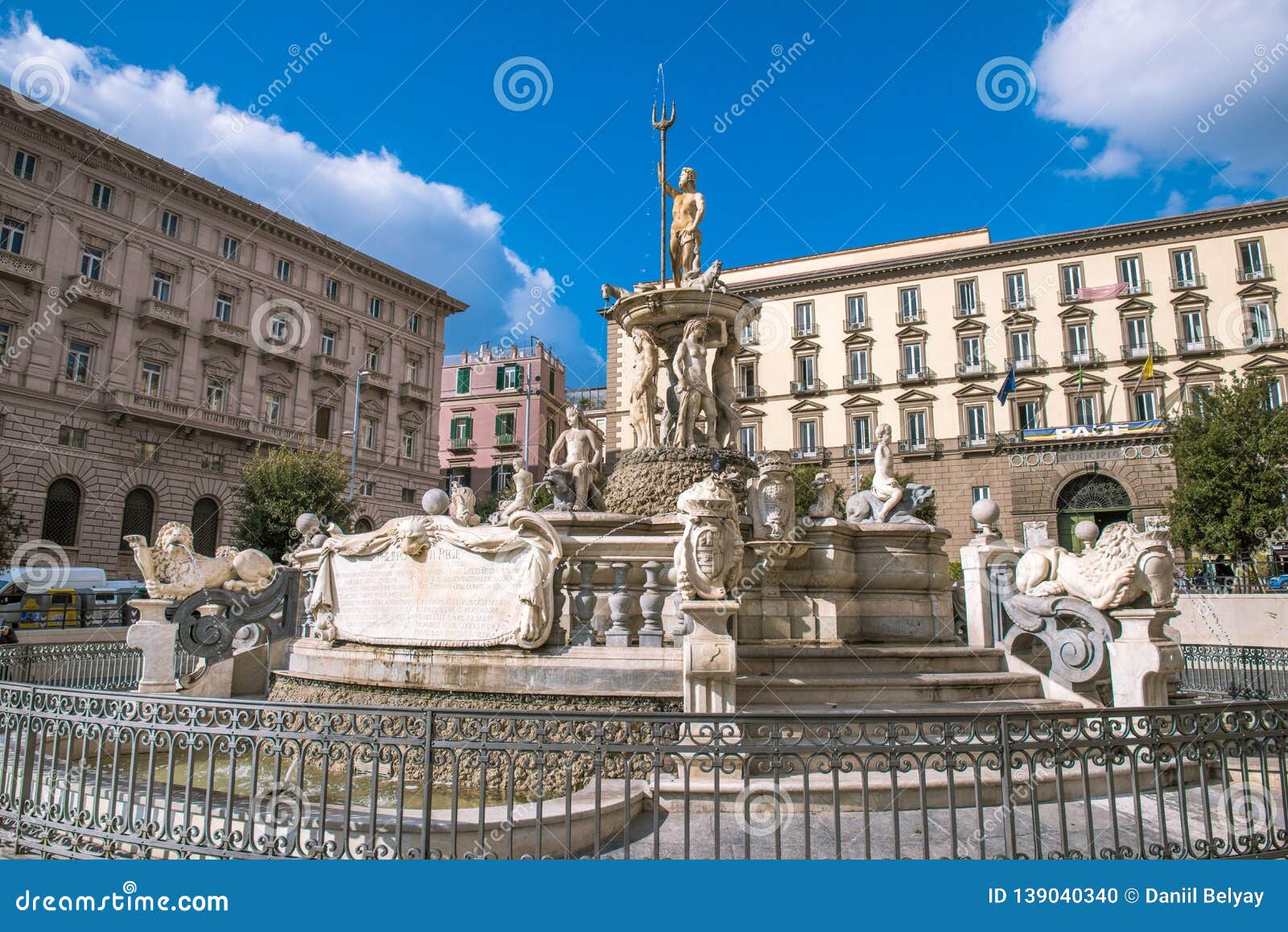 city hall square with the famous neptune fountain on piazza municipio in naples, italy.