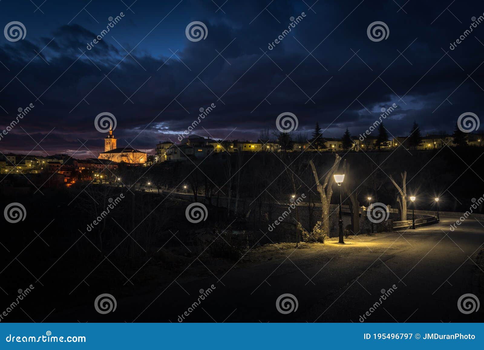 city landscape of colmenar de oreja illuminated at night, spain