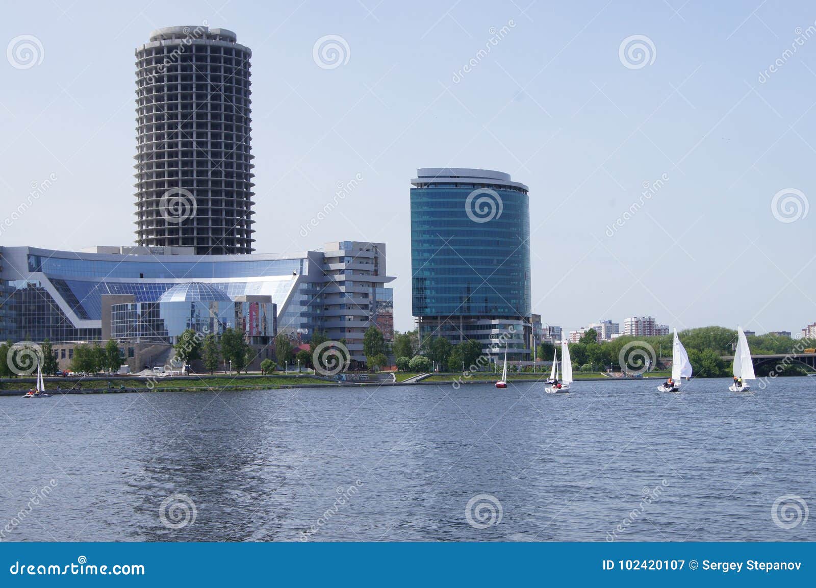 Summer. Panorama of a city pond in the city of Yekaterinburg. Yachts with white sails.