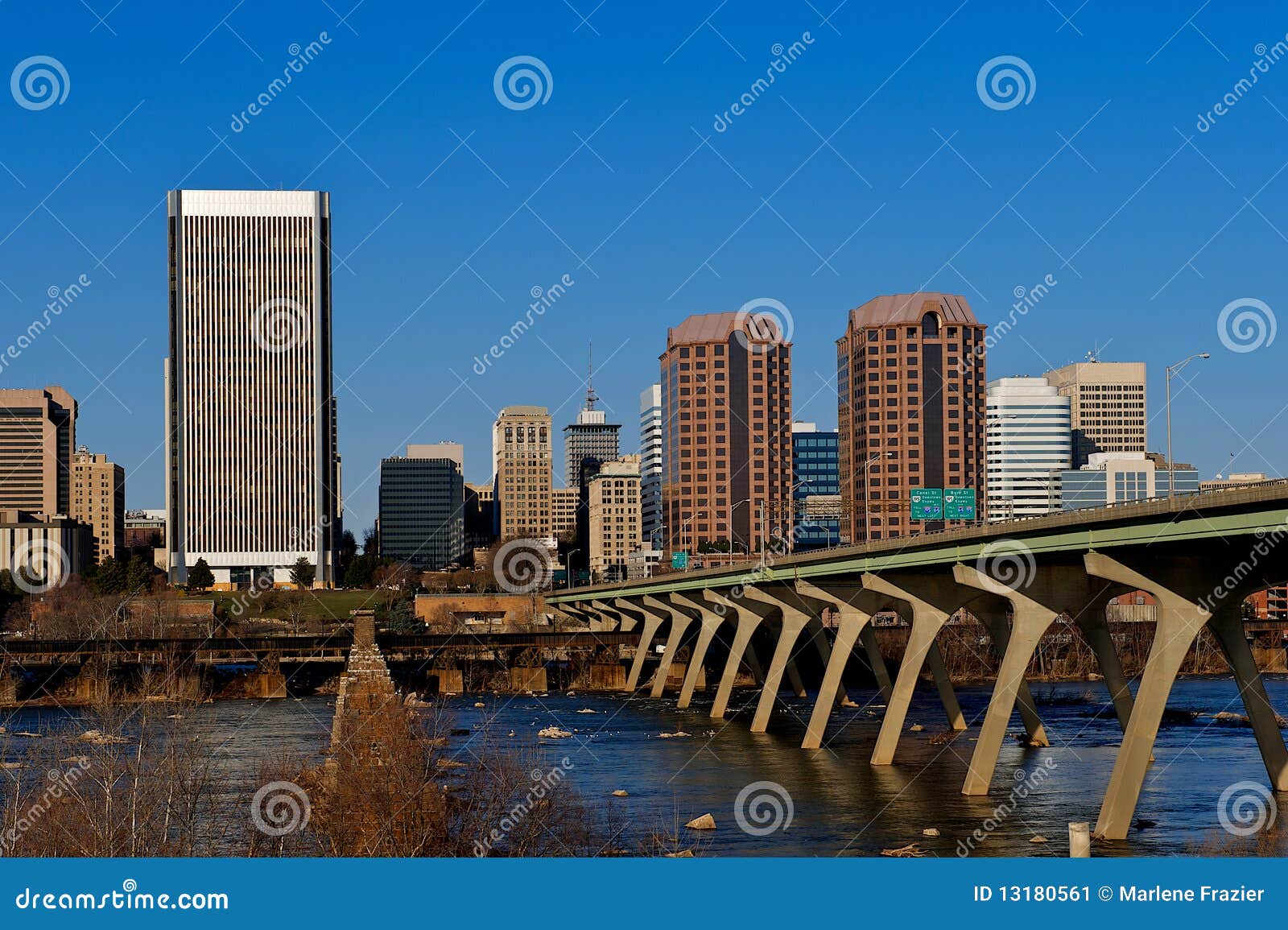 City of Richmond Virginia. The city of Richmond, Virginia seen from the Flood wall surrounding the James River. The Manchester Bridge into the city also visible.