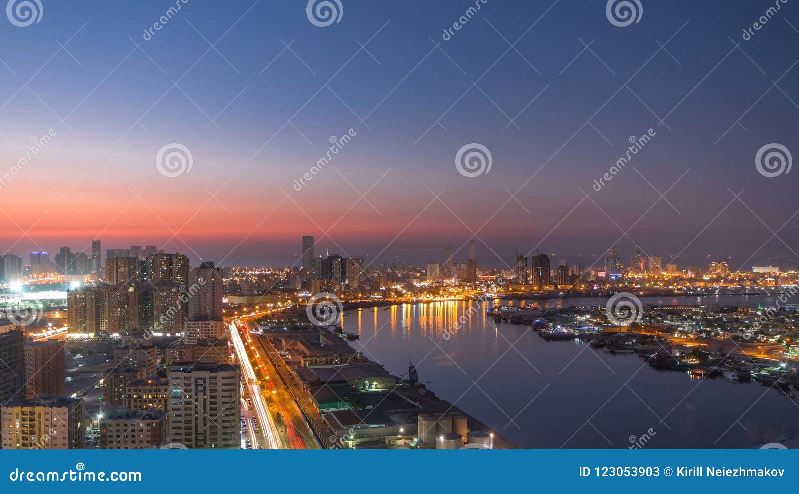 cityscape of ajman from rooftop day to night timelapse. ajman is the capital of the emirate of ajman in the united arab emirates.