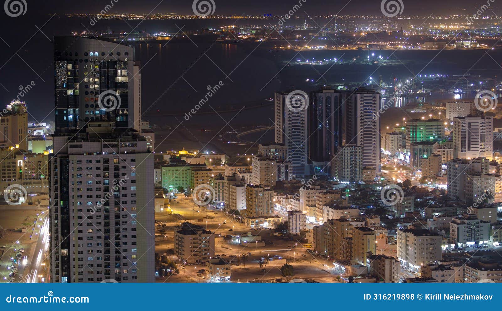 cityscape of ajman from rooftop night aerial timelapse