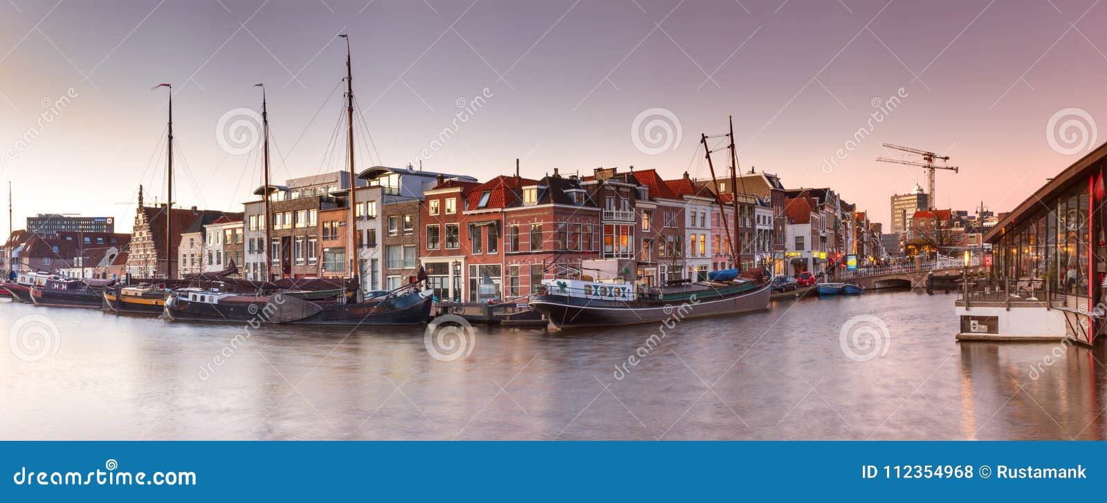 cityscape, panorama, banner - view of city channel with ships, the city of leiden