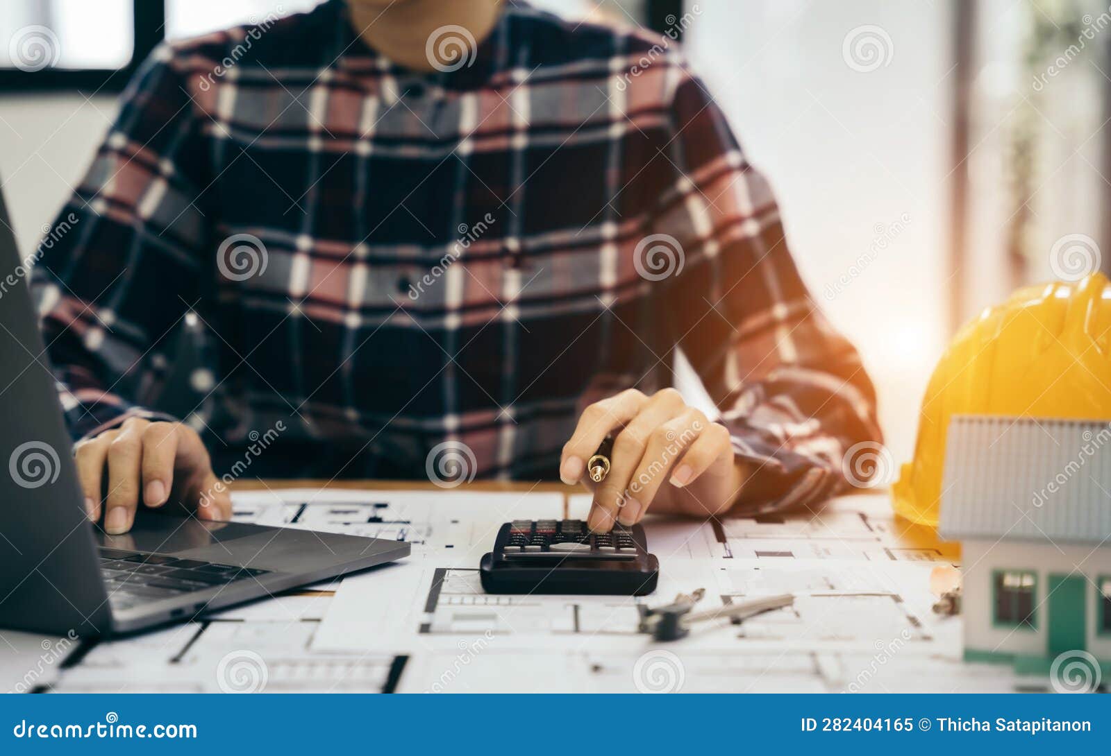 Civil Engineer or Architect Business Useing Calculator about Calculate the Cost with for Working