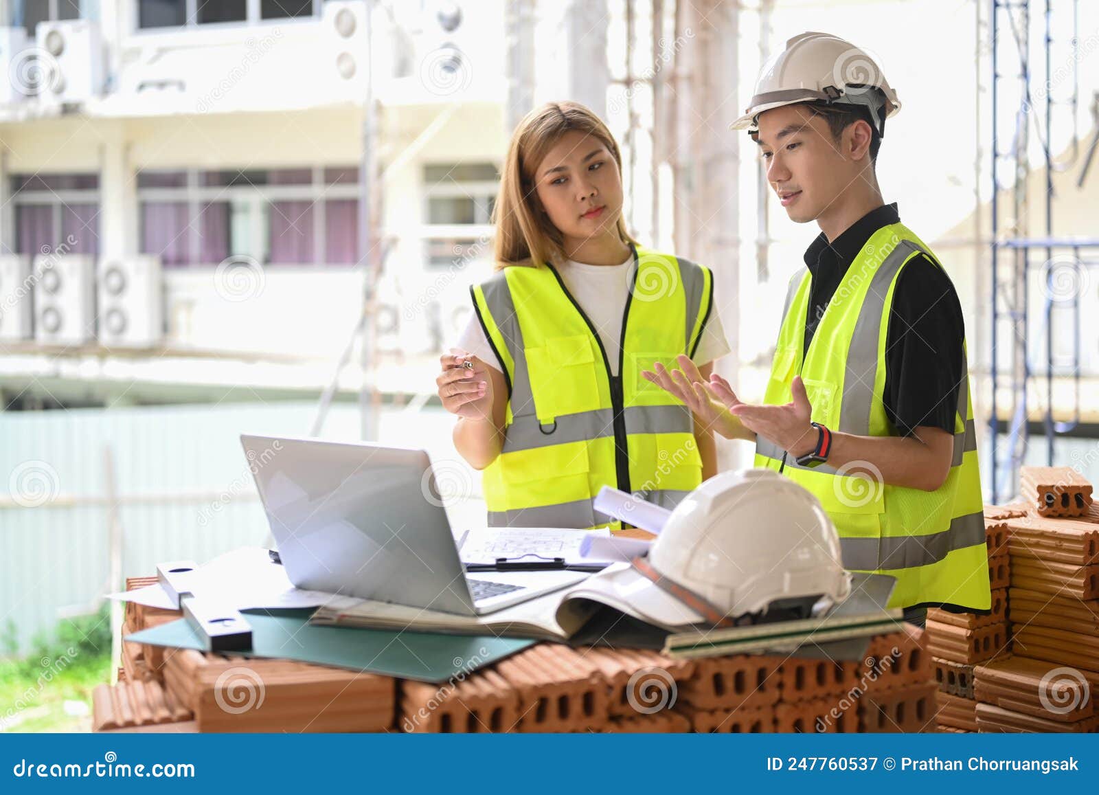 Civil Engineer and Specialists Working, Checking Plan Together at