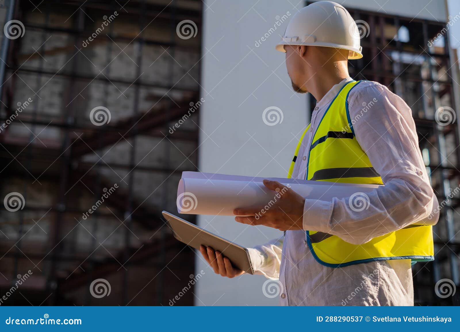 Civil Engineer Using a Tablet, Planning a Project, Builds a Modern