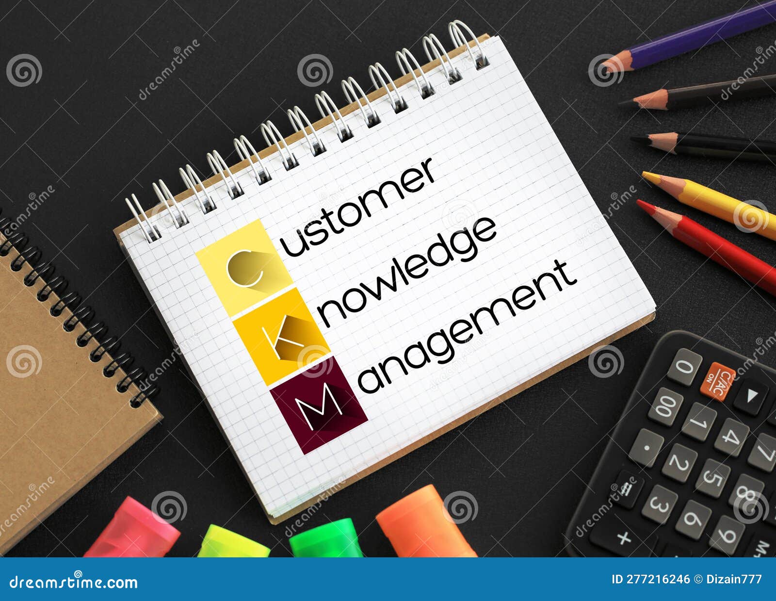 ckm - customer knowledge management acronym on notepad, business concept background