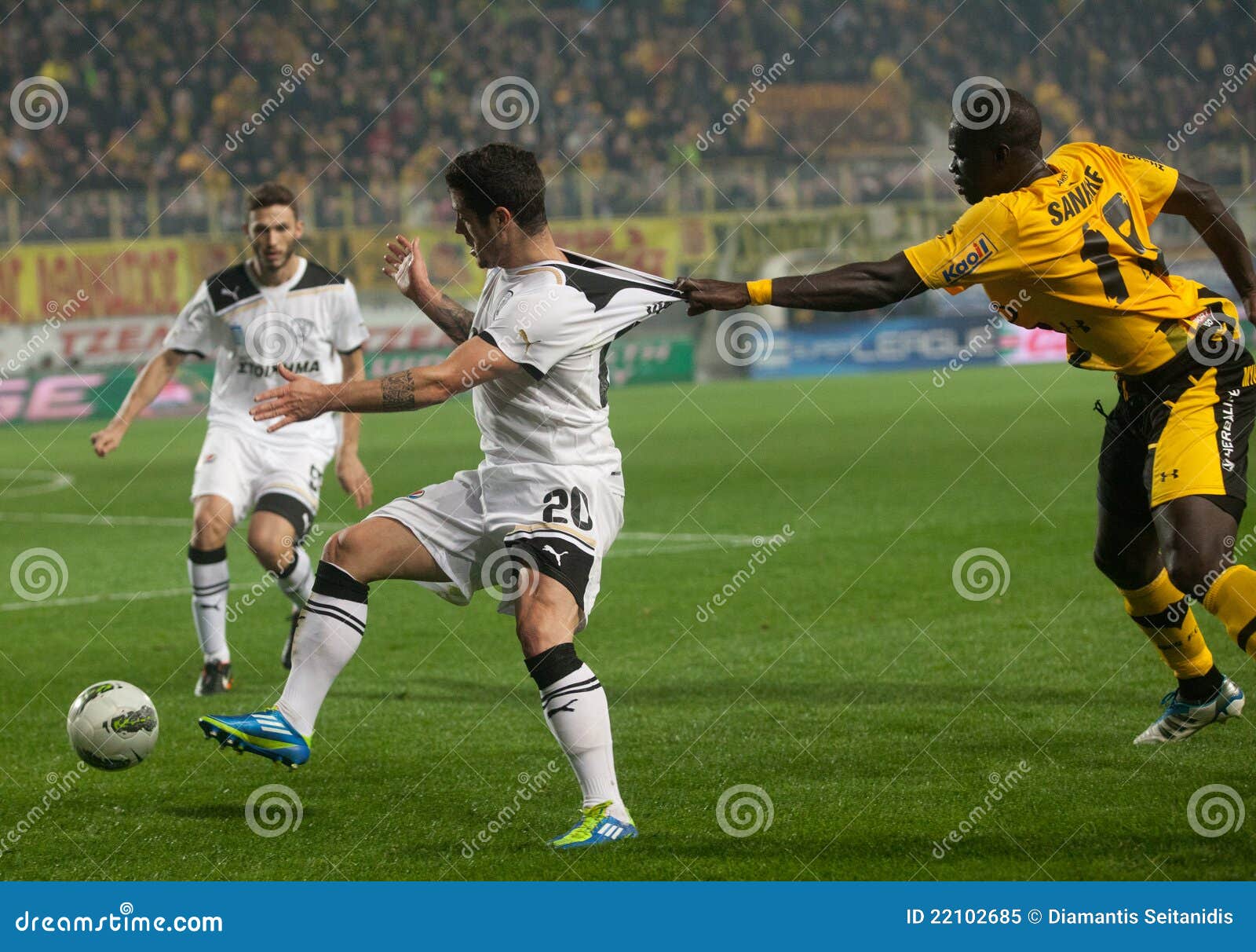 Claiming The Ball Between Players Of Football Editorial Image - Image