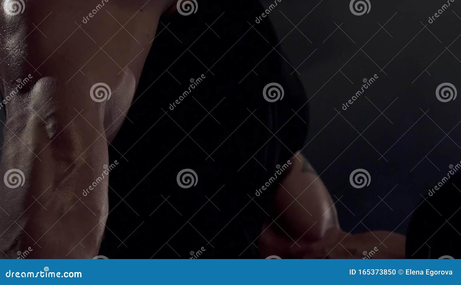 Classes in the Gym. Male Muscles are Pumped Up. Muscle Work Closeup