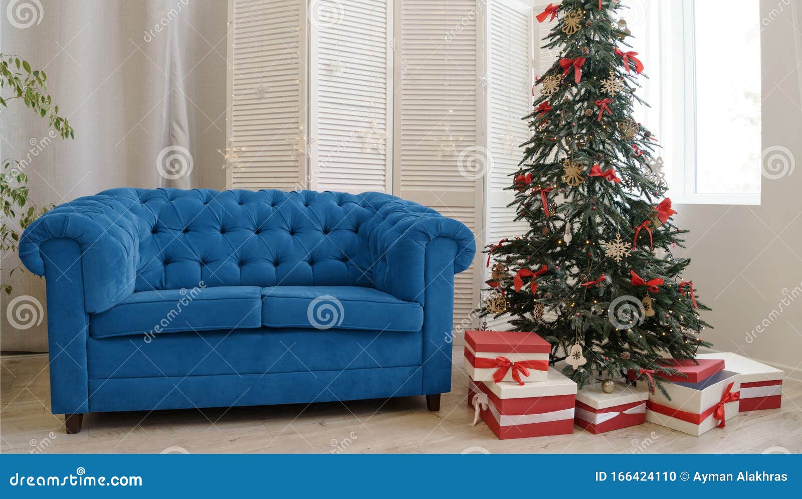 Classic Blue Color Sofa and Decorated Christmas Tree Inspired by Color
