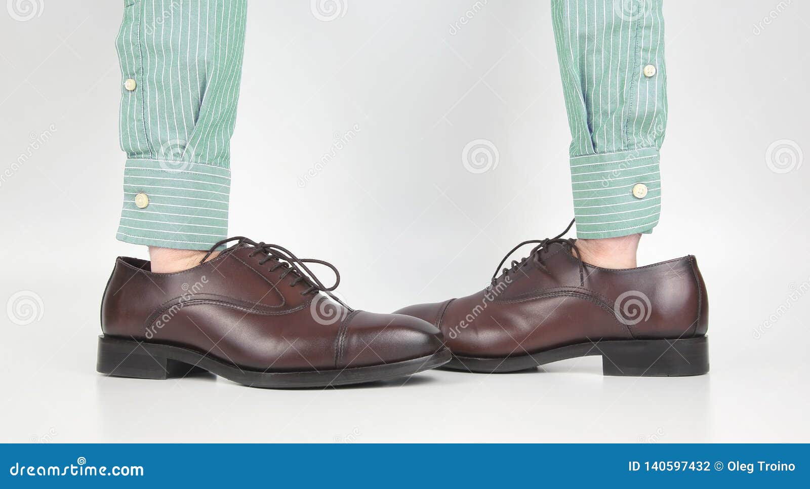 Classic Brown Shoes Worn on the Hands on a White Background Stock Photo ...