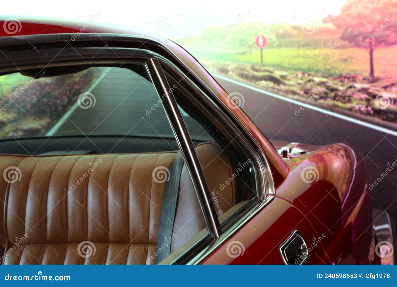 classic  car. red car. view of the rear seat in brown leather. close up. high-end car. collectable. vehicle. conveyance. rea