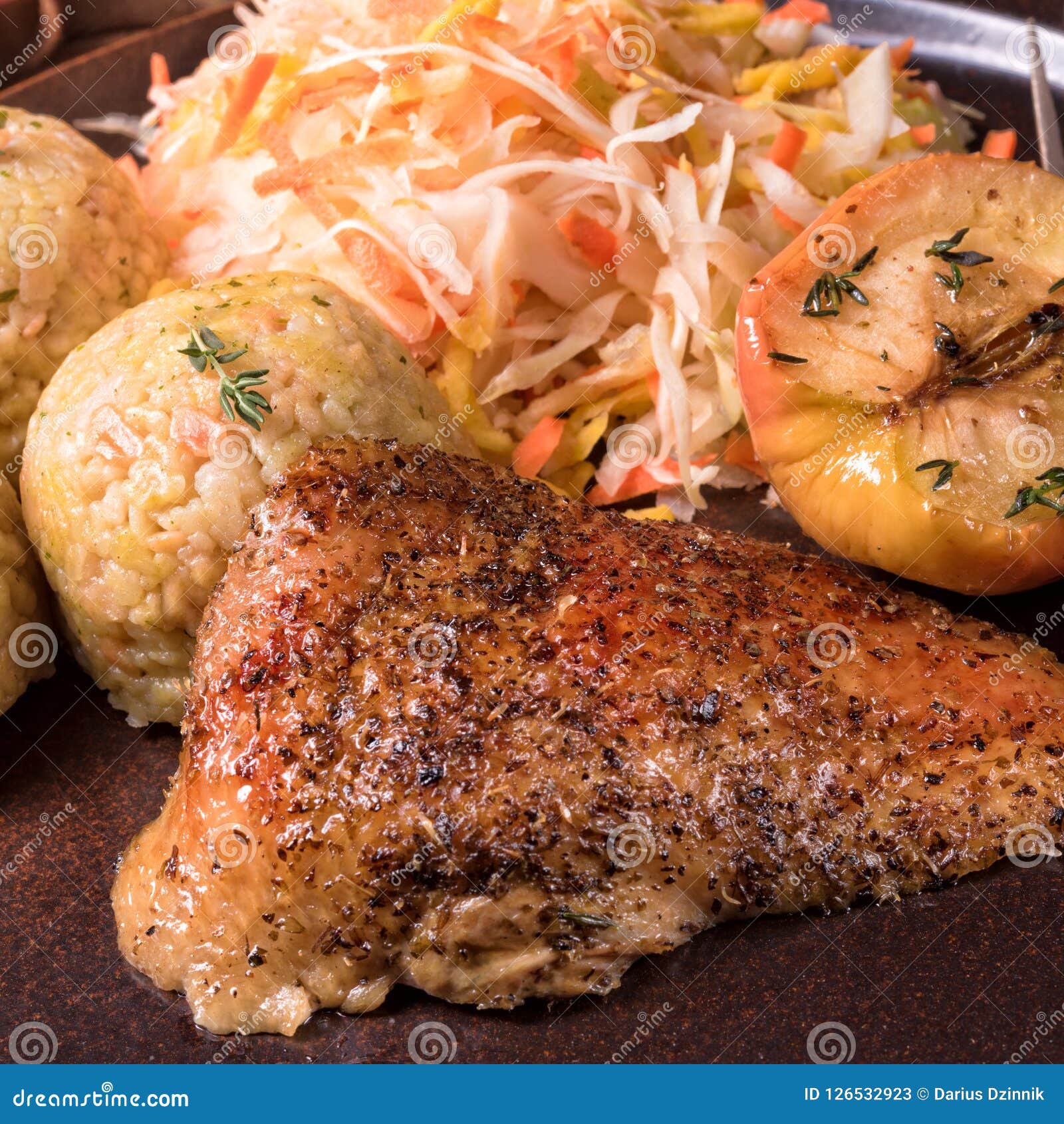 A Classic and Crispy Roasted Duck with Cabbage and Dumplings Stock