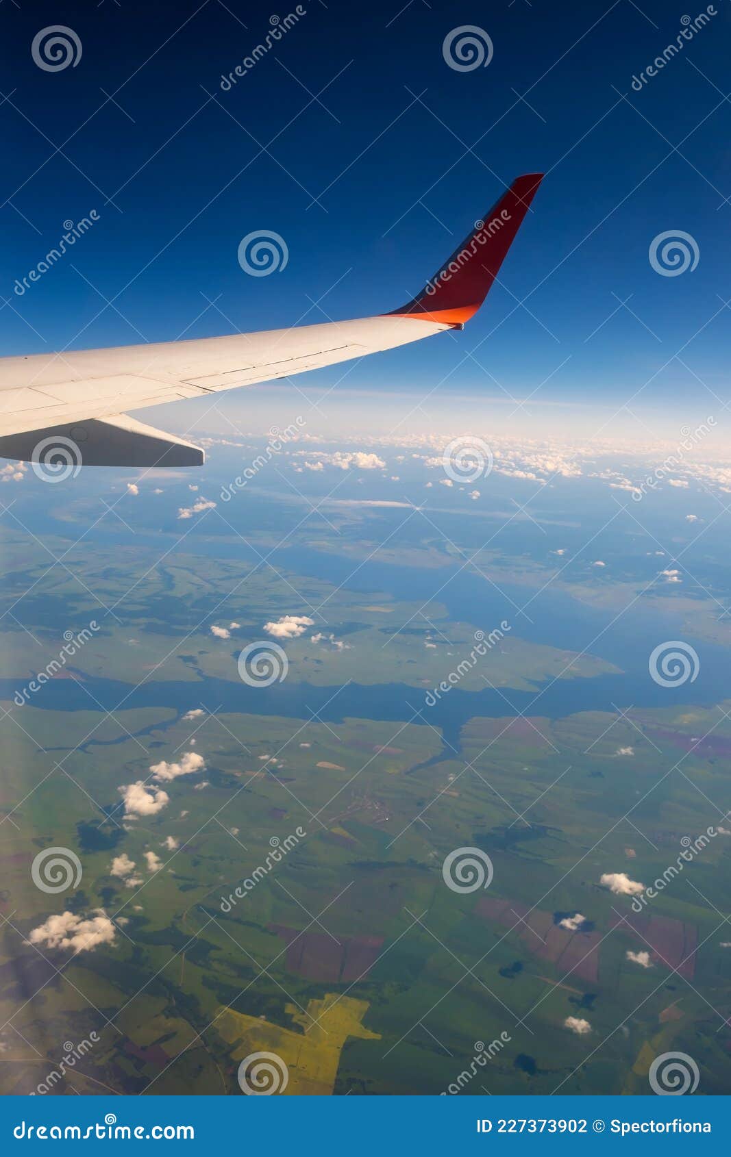 Classic Image through Aircraft Window Onto Wing. Flight View Over