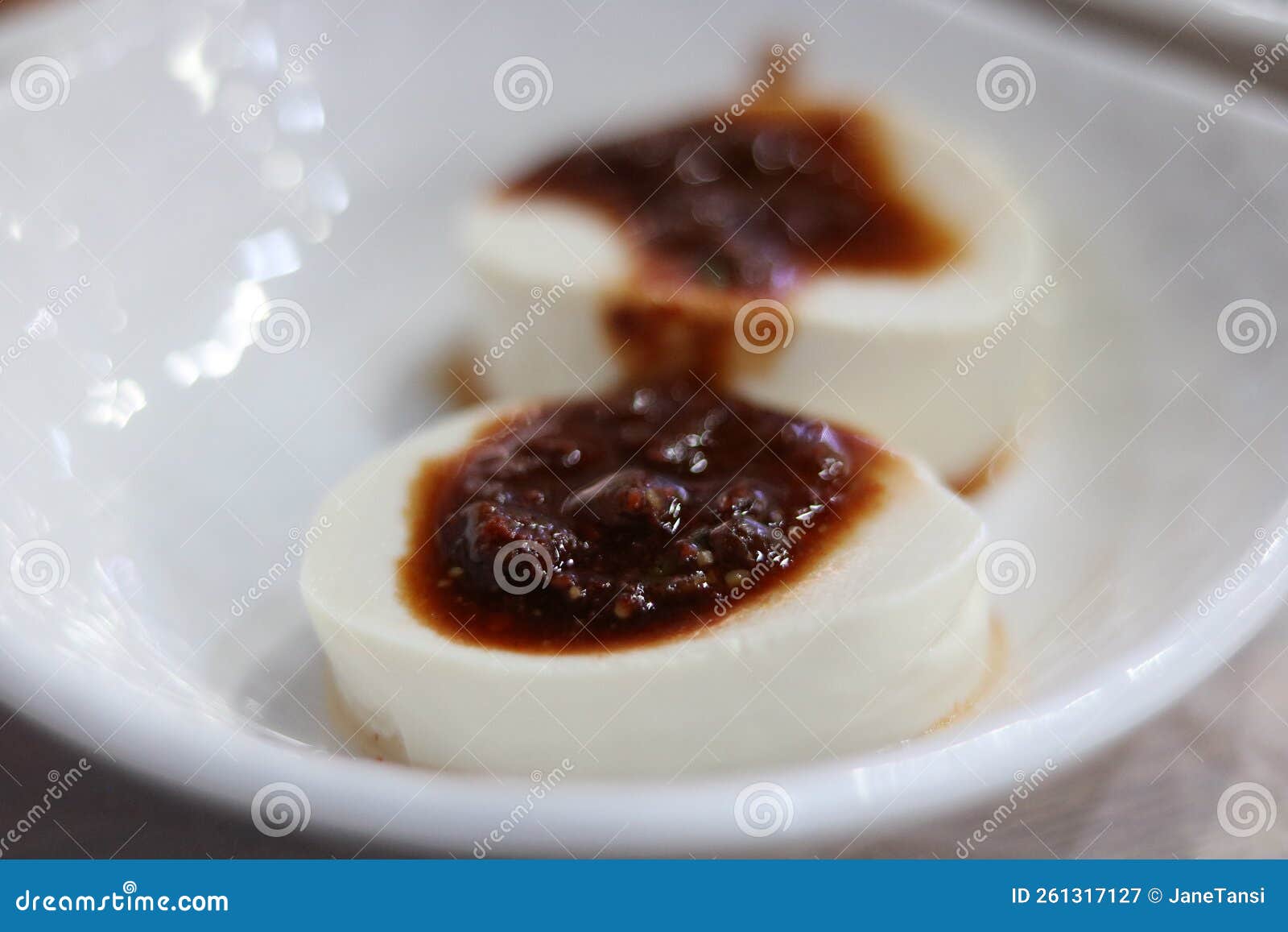 Classic Korean Tofu with Soy Sauce and Chilli on Plain White Dish Stock