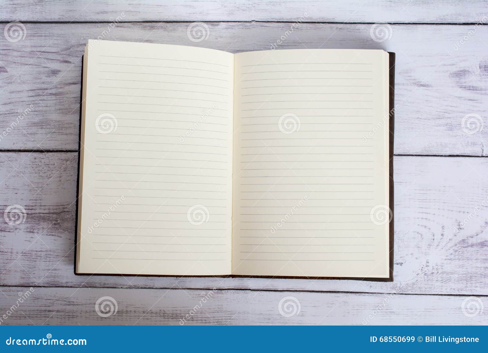 Classic Leather Bound Journal Book Open on a White Barn Board Floor