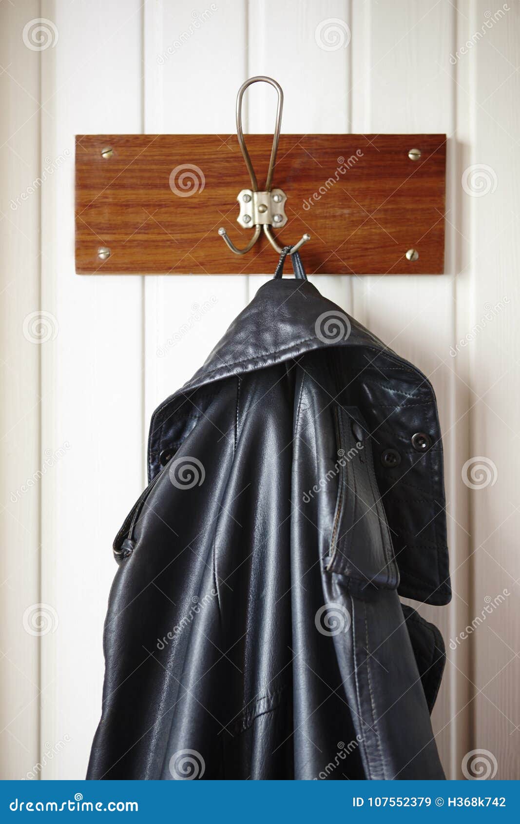 Classic Male Black Leather Jacket Stored on a Hanger Stock Image