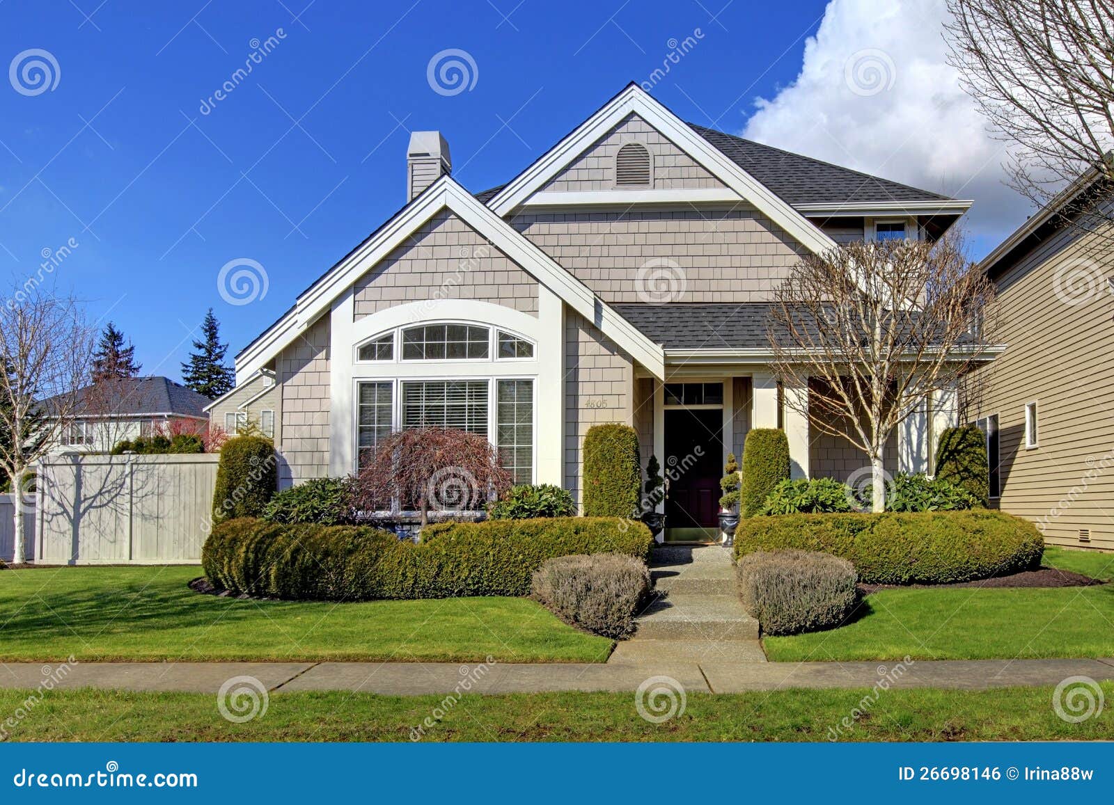 classic new american house exterior in the spring.