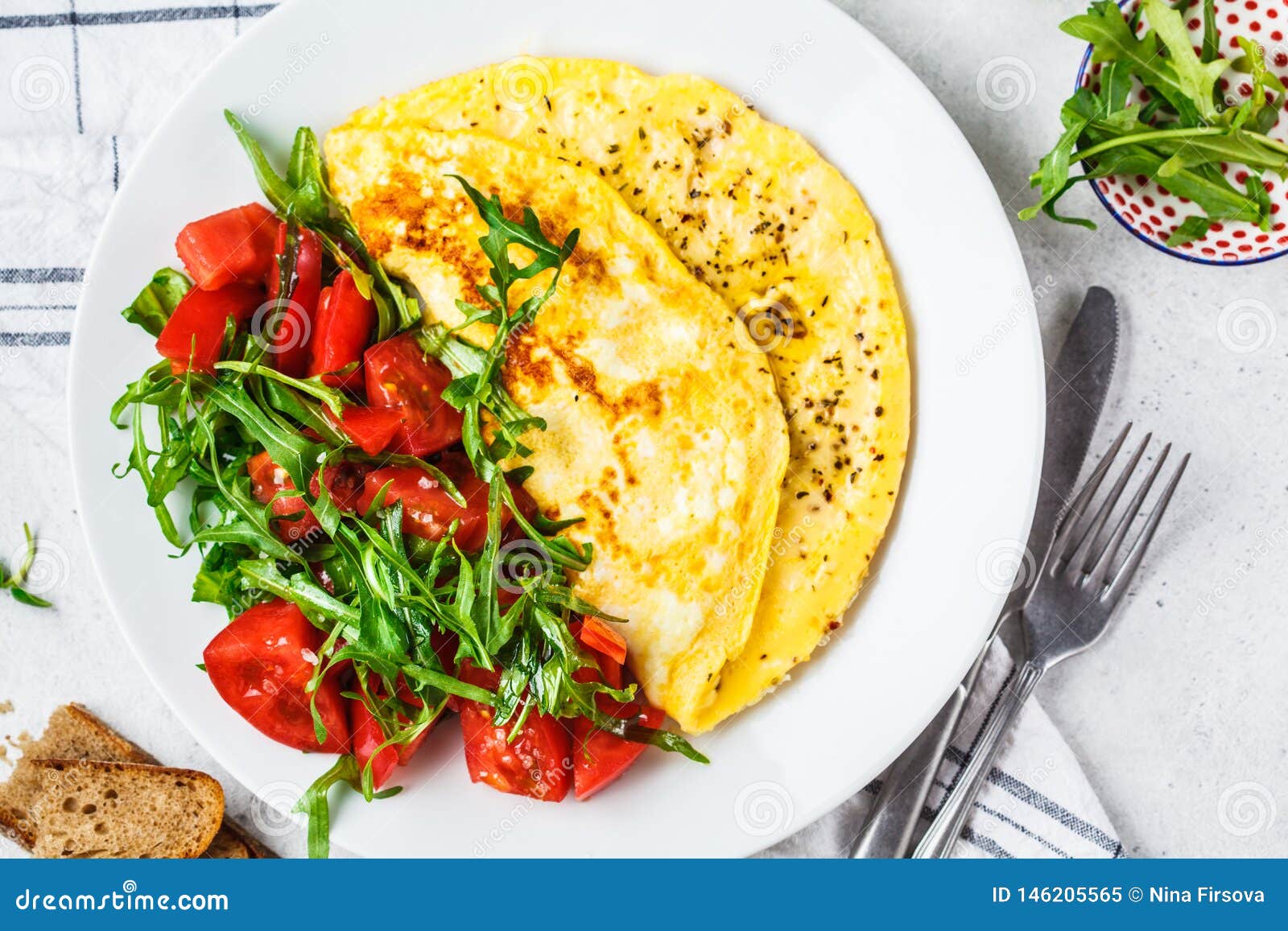 Classic Omelet with Cheese and Tomatoes Salad on White Plate, Top View ...