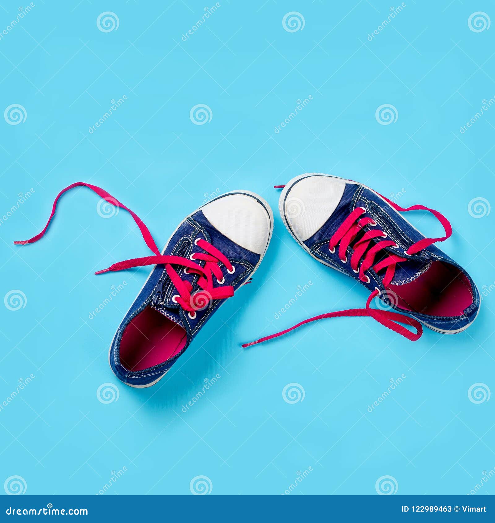 Classic Sneakers Over Light Blue Background, Above View. Image W Stock ...