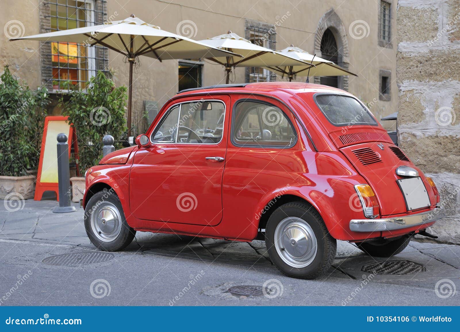 classic streetscene with red fiat car