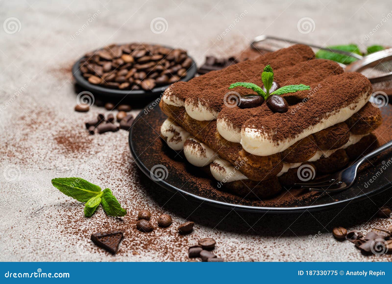 Classic Tiramisu Dessert on Ceramic Plate on Concrete Background Stock