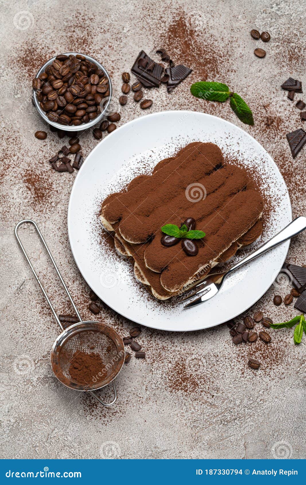 Classic Tiramisu Dessert on Ceramic Plate on Concrete Background Stock