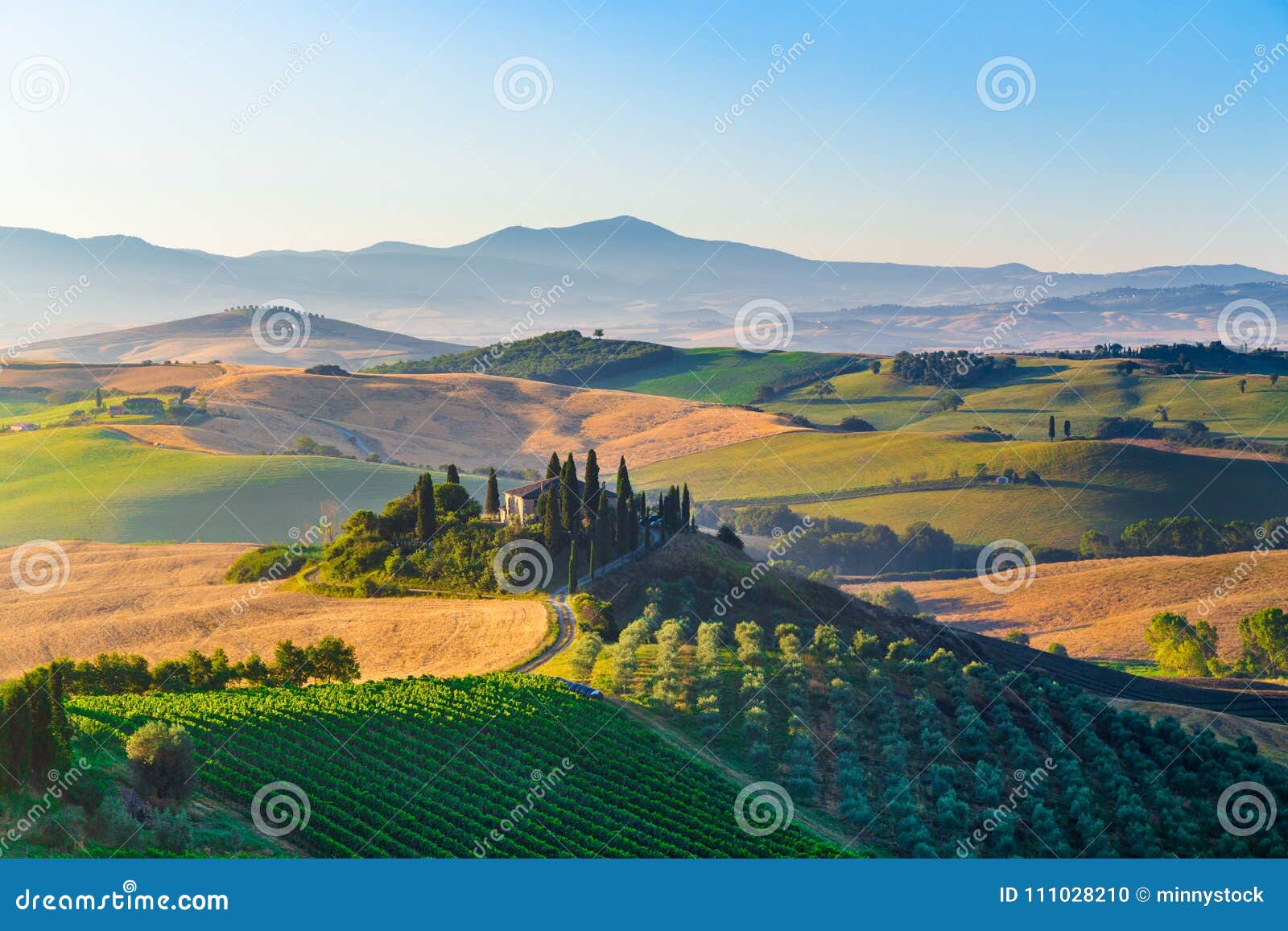scenic tuscany landscape at sunrise, val d`orcia, italy