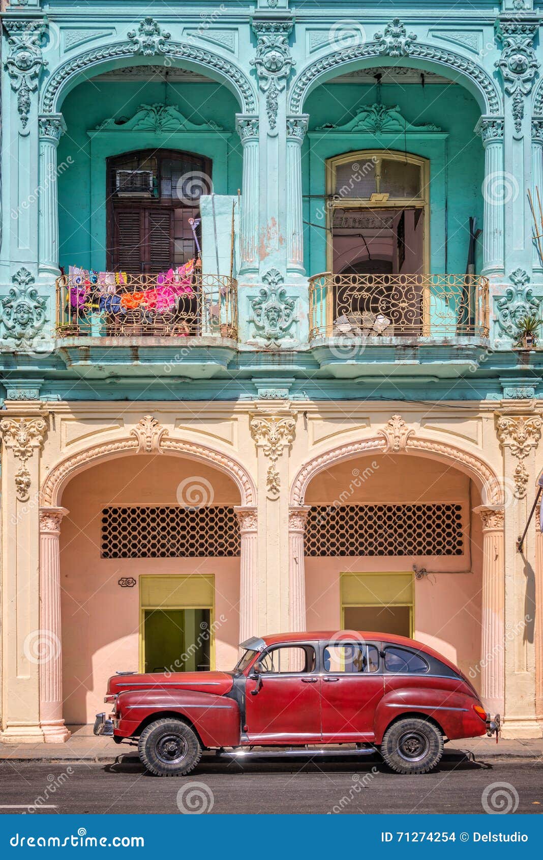 classic vintage car and coloful colonial buildings in old havana