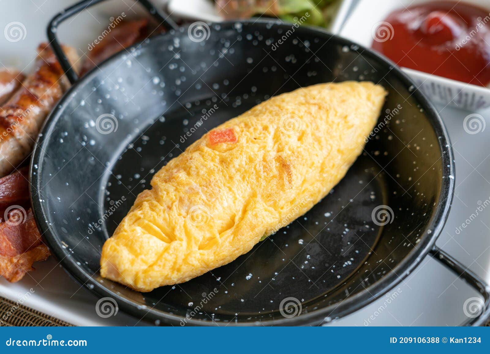 Classic Western Breakfast Plate with Omelette, Sausages and Bacons