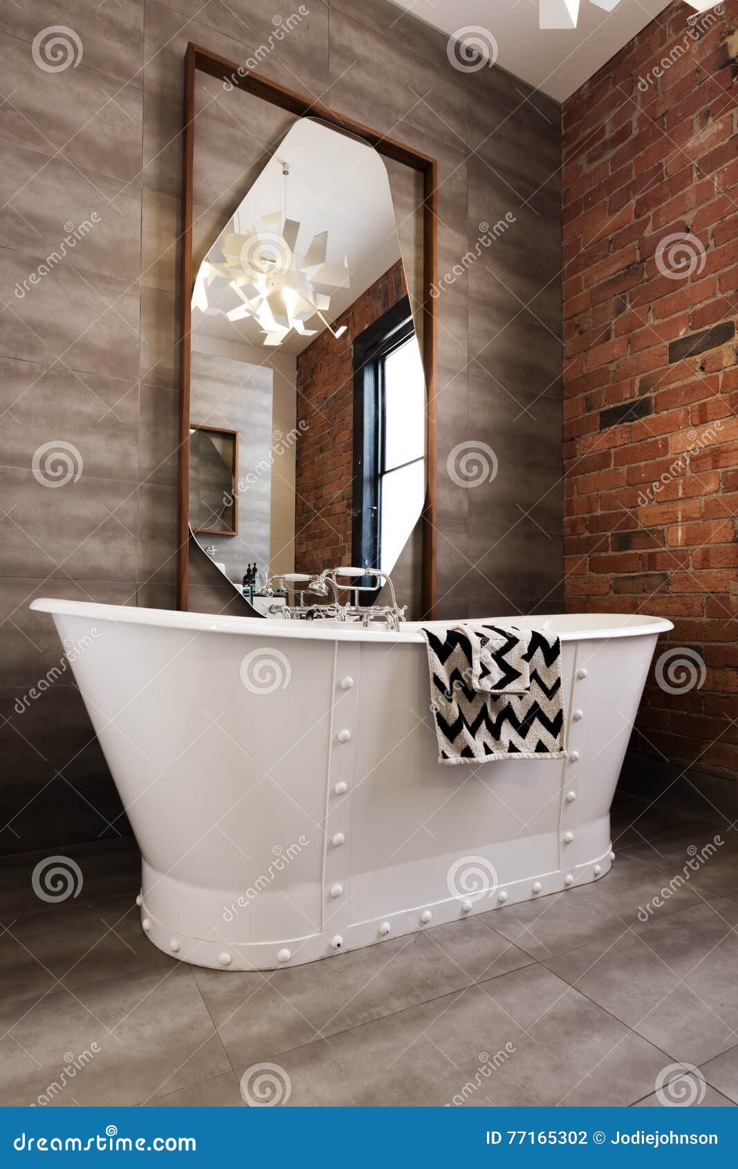 classic white freestanding iron look bathtub in renovated bathroom