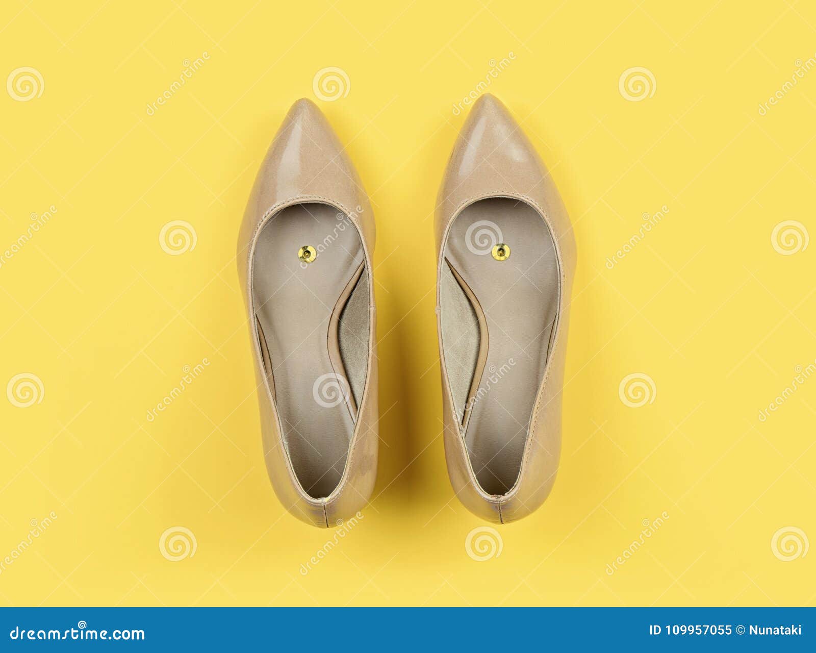 Classic Women`s Beige Shoes with Pushpin on Yellow Stock Image - Image ...