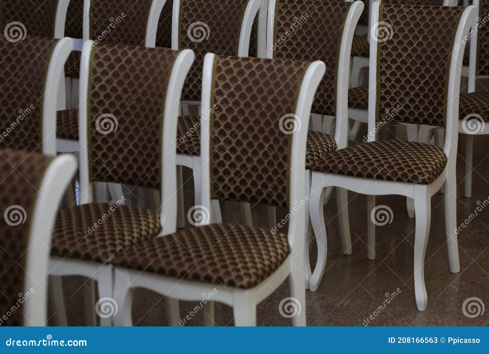 Classic Wooden Chairs are Arranged Symmetrically in the Hall Stock