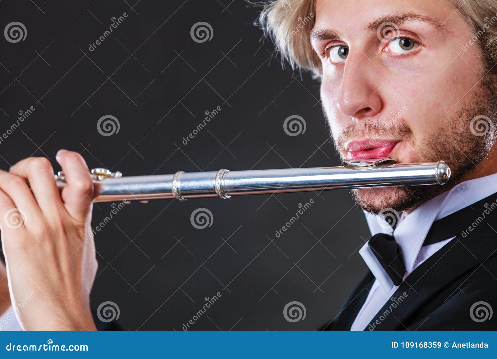 Elegantly Dressed Male Musician Playing Flute Stock Image Image of