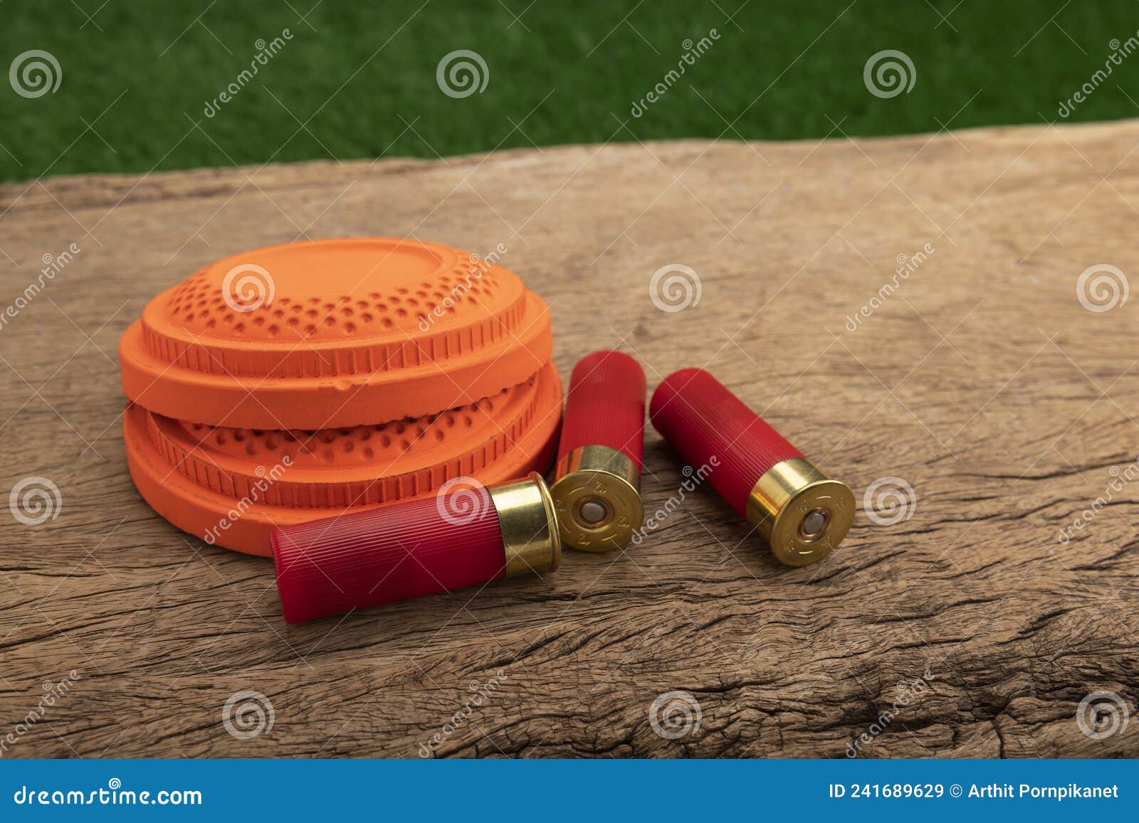 Clay Disc Flying Targets and Shotgun Bullets on Wooden Table Background ,Clay Pigeon Target Game Stock Image