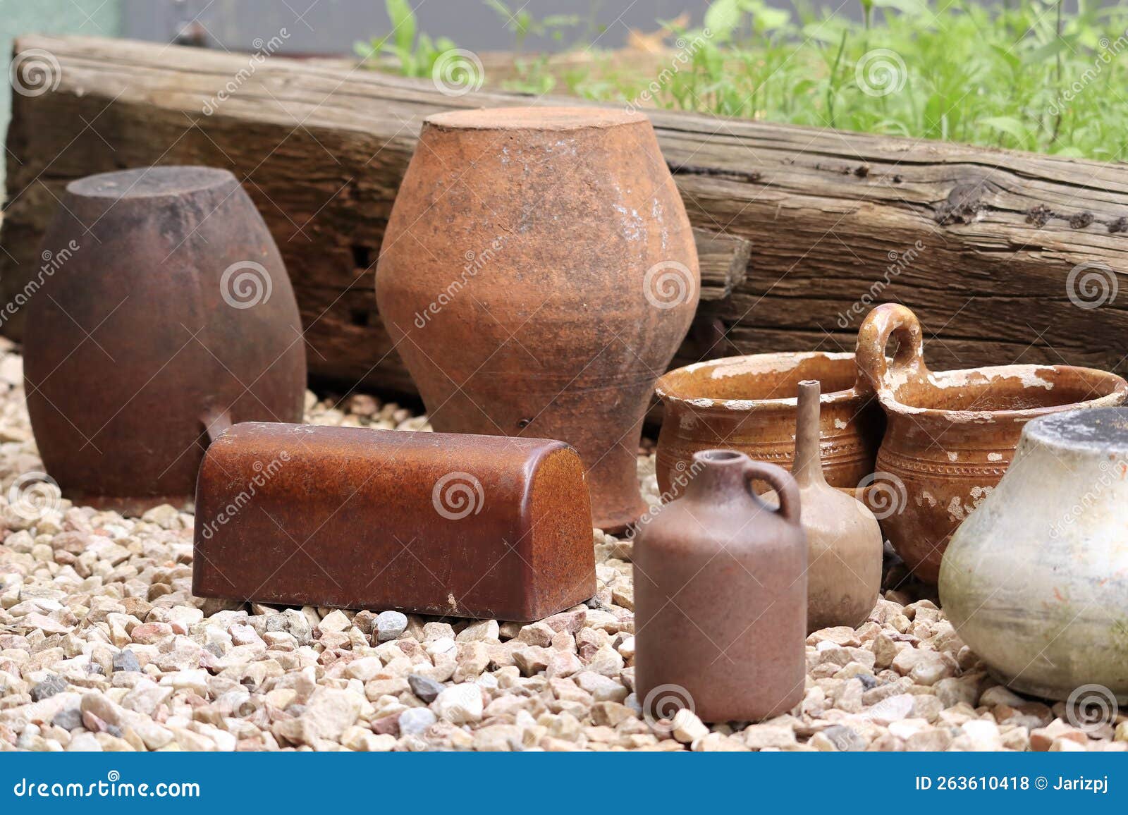 clay pots arranged in a row as a decoration, an ornament in the garden