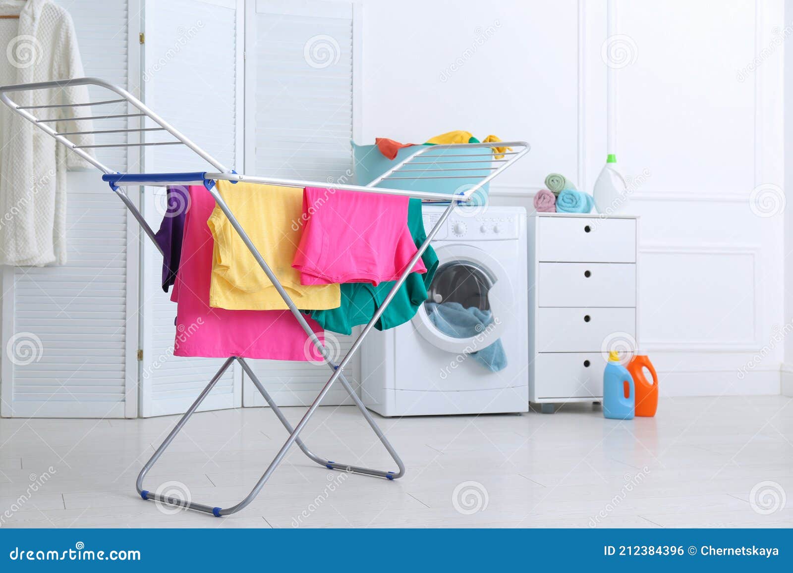 Clean Bright Laundry Hanging on Drying Rack Indoors Stock Photo Image
