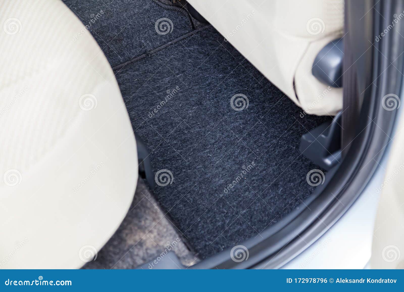 Clean Car Floor Mats Of Black Carpet Under Rear Passenger Seat In