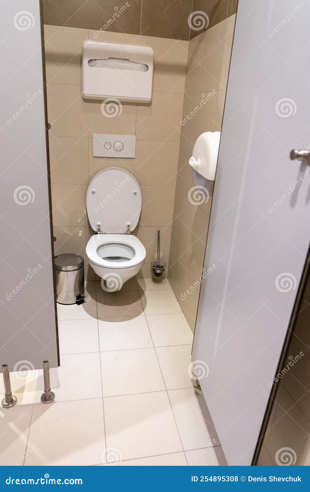 Clean Empty Toilet Cubicle with Open Door in Public Restroom Stock