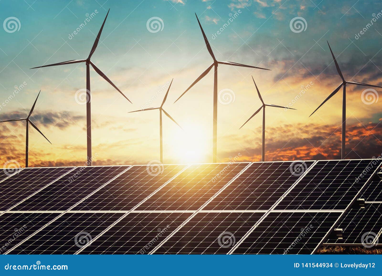 clean energy power concept solar panel with wind turbine and sunset