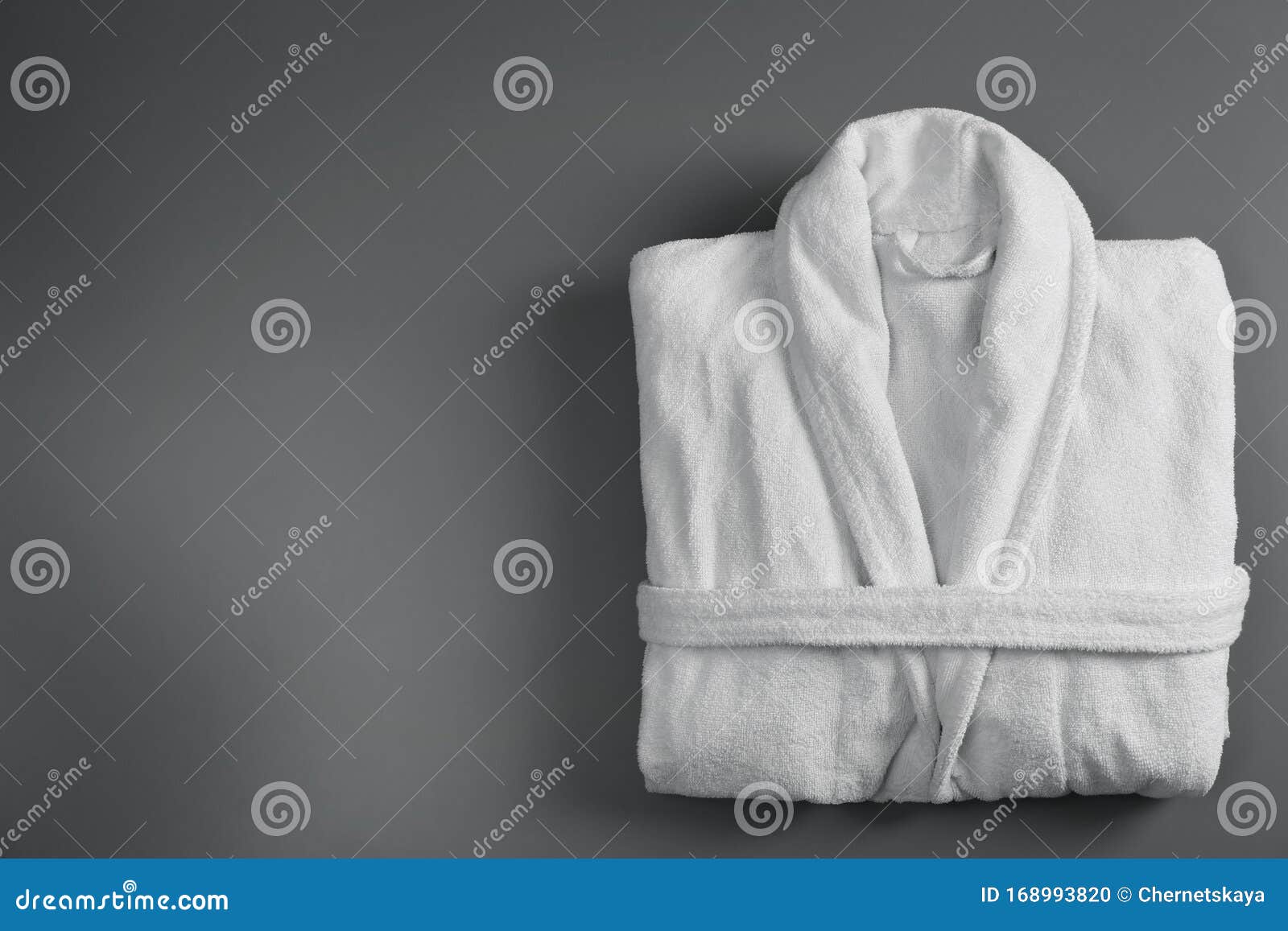 Clean Folded Bathrobe on Grey Background. Space for Text Stock Photo ...